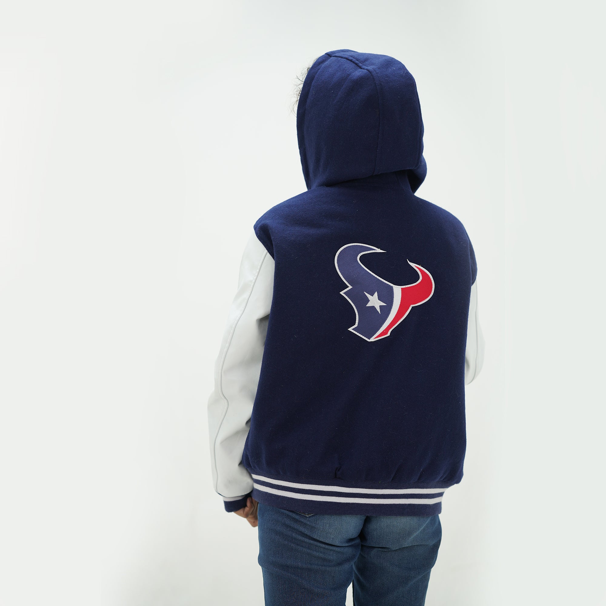 Back view of women Texans hooded varsity jacket displaying navy and white construction perfect for game day wear in Houston for ladies 