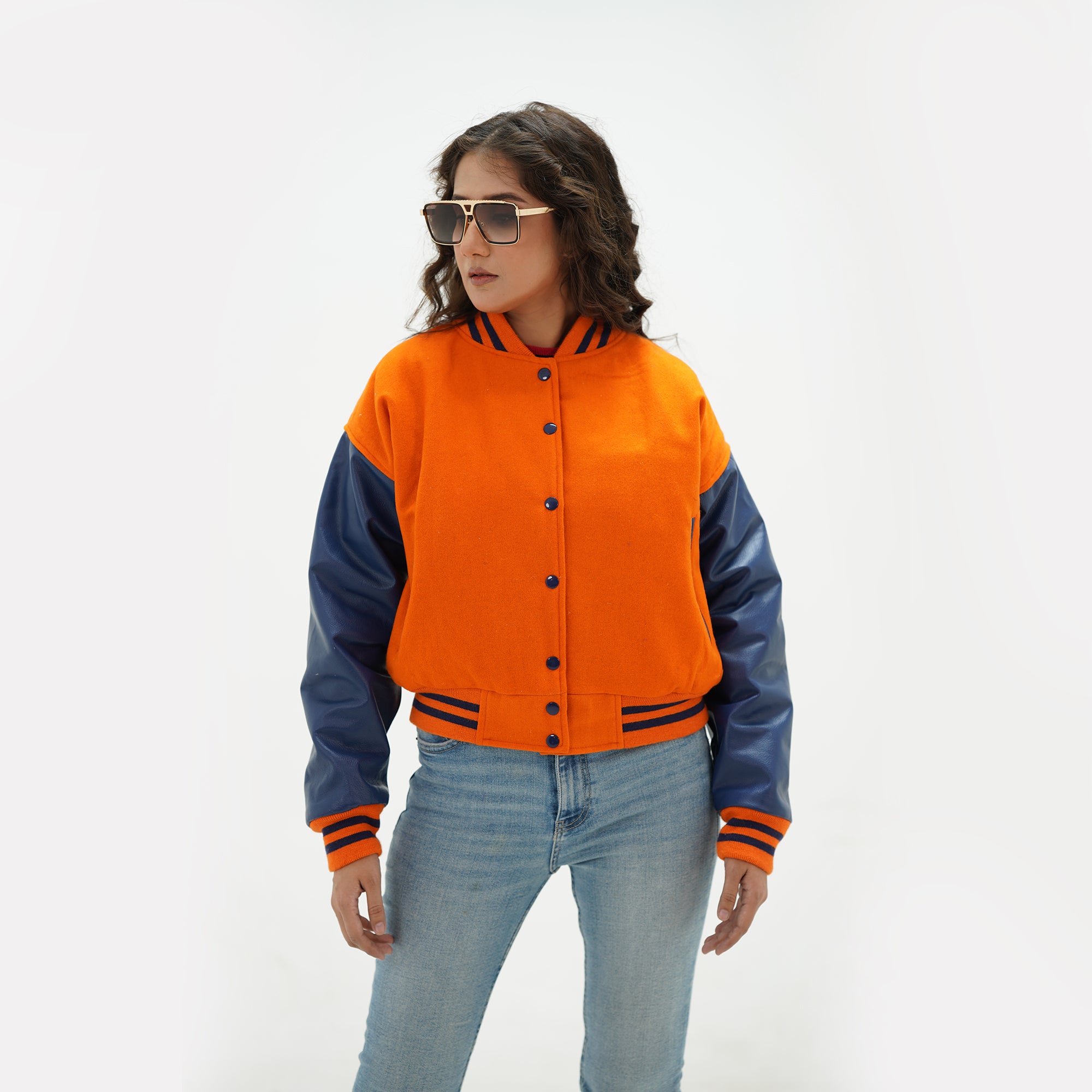 Full display of women's orange and java plum crop jacket showing complete cropped fit, premium wool-leather combination, and vibrant color contrast