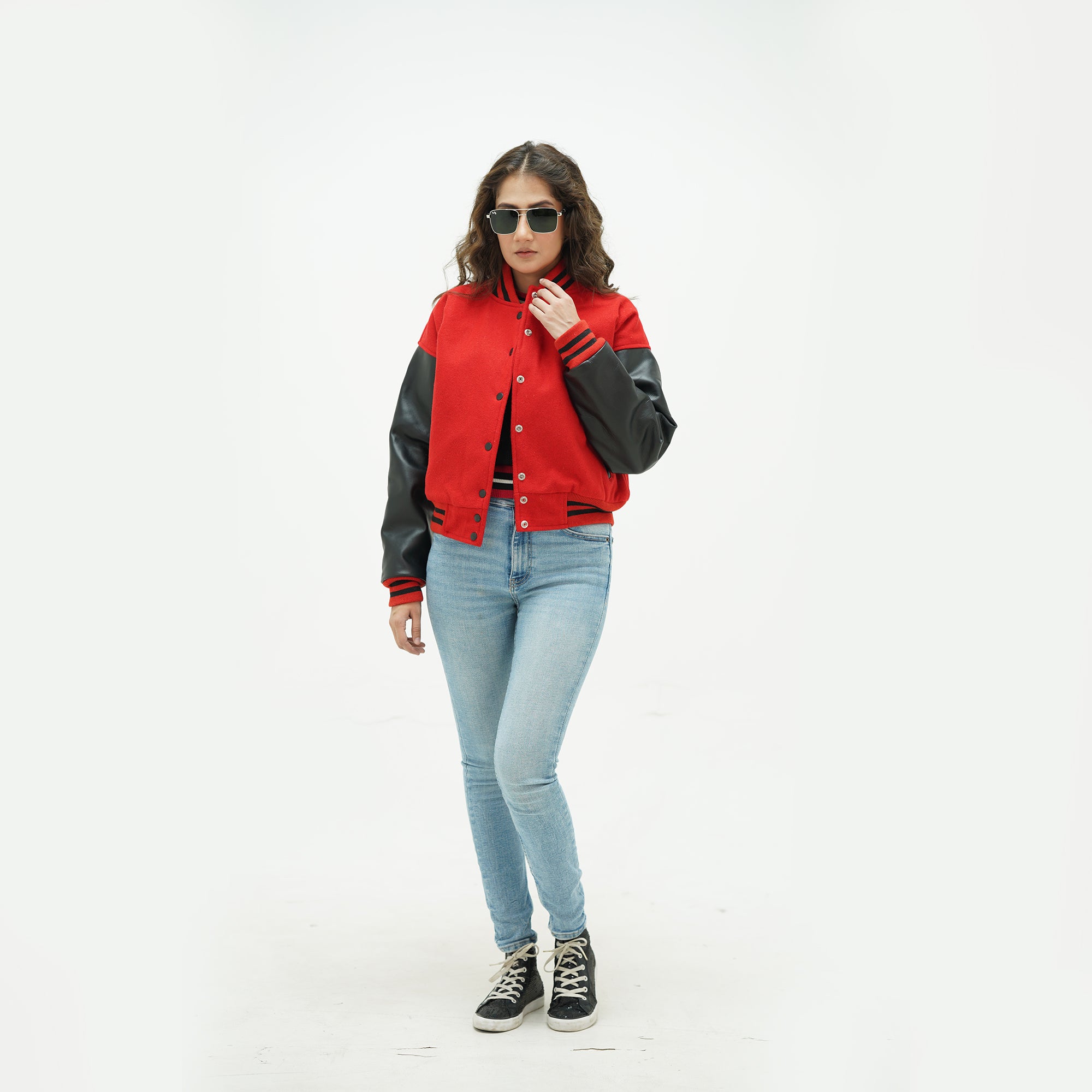 Full display of women's red and black varsity jacket showing complete fit, premium materials, and classic red-black varsity styling